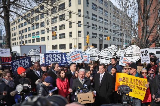 Jimmy Van Bramer, center, speaks during a coalition rally and press conference of elected officials, community organizations and unions opposing the Amazon headquarters getting subsidies to locate in Long Island City.